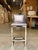 Contemporary counter stool featuring a striking metallic indigo leather seat and back with a smooth, tailored silhouette...