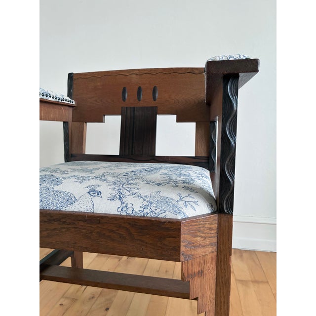 Dutch Amsterdam School / Hague School Art Deco chair from the 1920s. The armchair is made of oak with coromandel accents,...