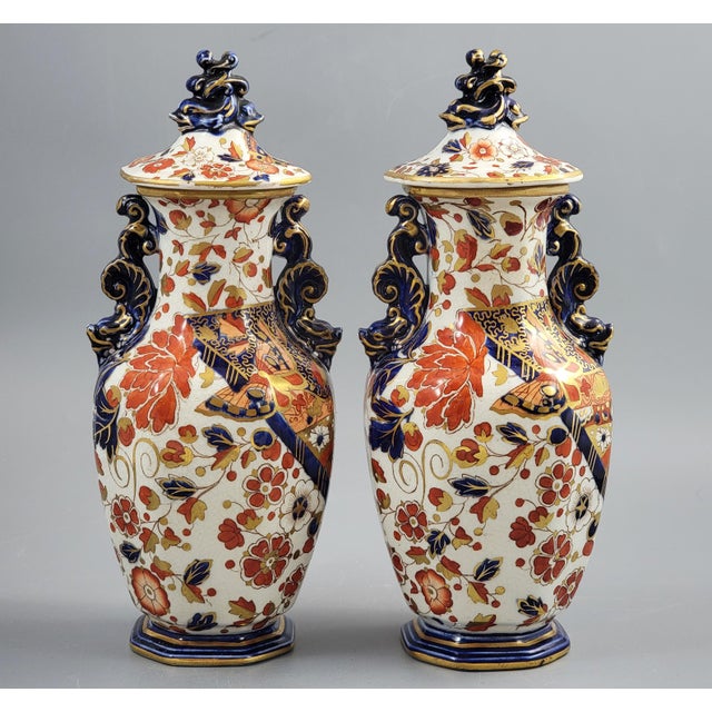 A decorative pair of English porcelain vases and covers by Ridgways, produced in the post-1891 period and decorated in the...
