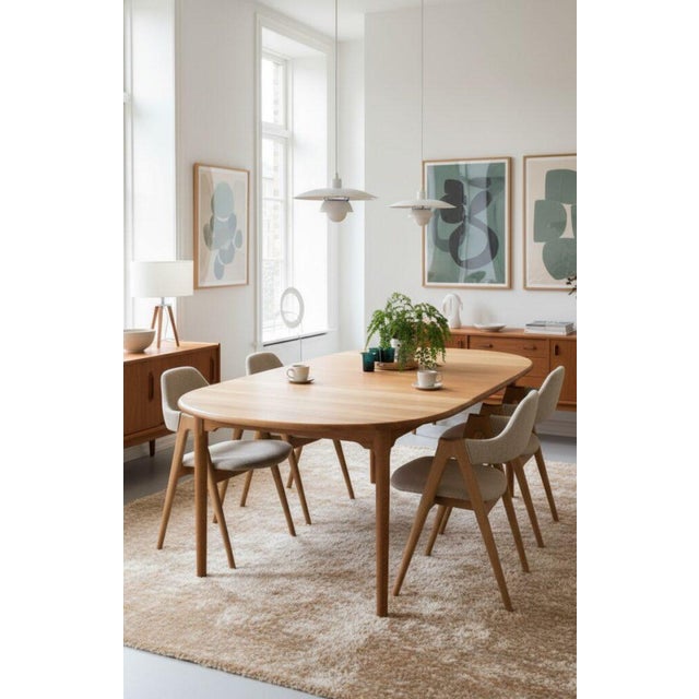 A large and elegant dining table designed by the renowned danish designer kurt østervig for kp møbler in denmark. A solid...