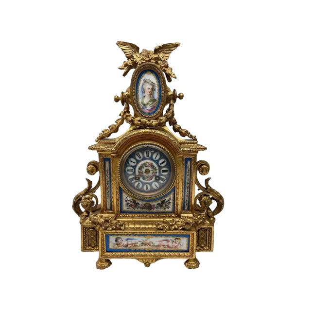 Exceptional and rare antique French garniture set by Japy Frères, featuring an ornate mantel clock with matching figural...