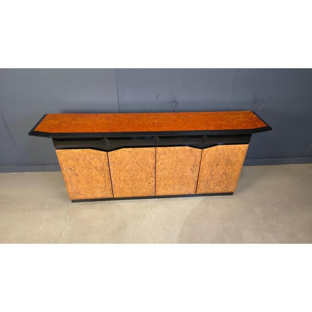 Luxurious 1980s sideboard made from black lacquered wood with burl wood doors and top. High quality piece. 1980s - France...
