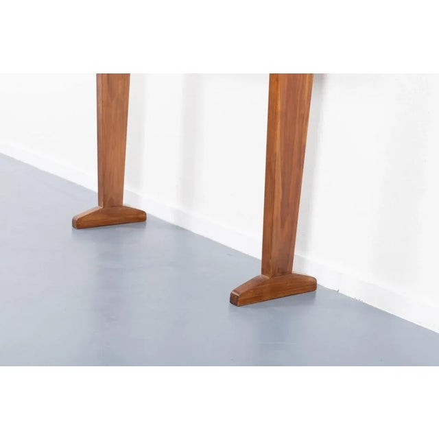 This beautiful piece has a sculptural walnut base with a loose crafted glass top. It can be a nice unit at your hallway or...