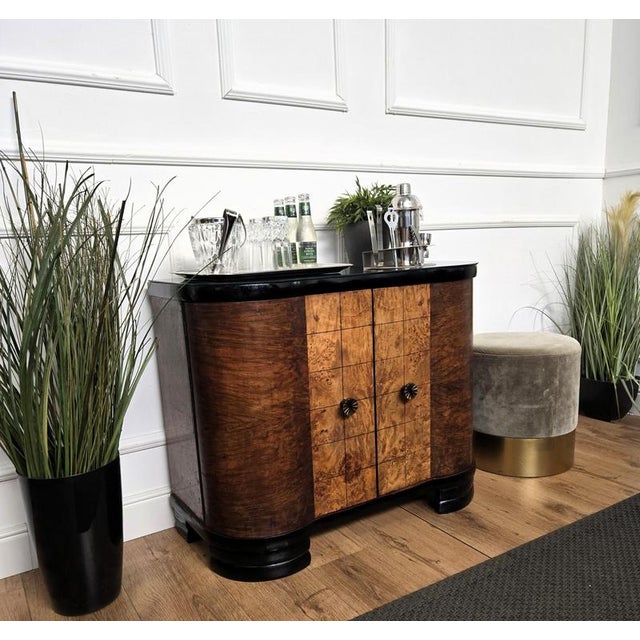 Very elegant Italian Art Deco Mid-Century Modern drinks dry bar cabinet with black glass top and beautiful veneer walnut...