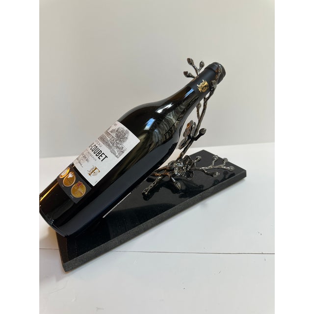Slick , elegant addition any home, this bottle rest features a modern black color and a unique orchid branch design. It...