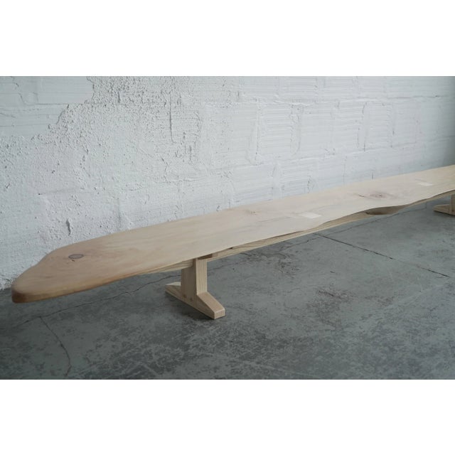 A long, low coffee table with ash legs and fir tabletop. Could also function as a shoe rack. Part of The Good Mod studio...