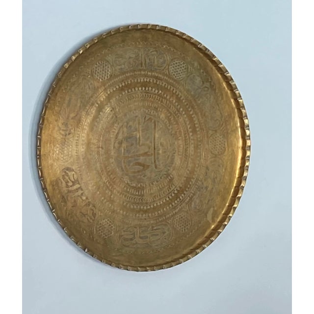Offered is a stunning large heavy vintage round brass Middle Eastern serving tray with embossed decorative design....