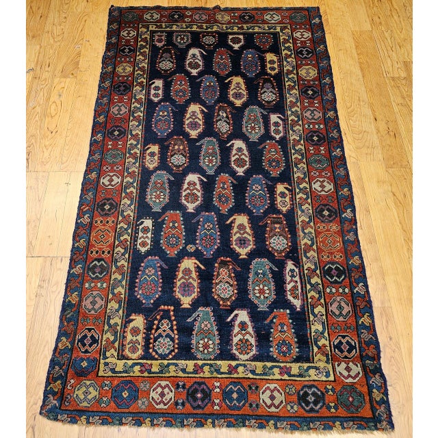 Discover the powerful artistry and unique beauty of this beautiful late 19th century Caucasian Kazak area rug. This rug...