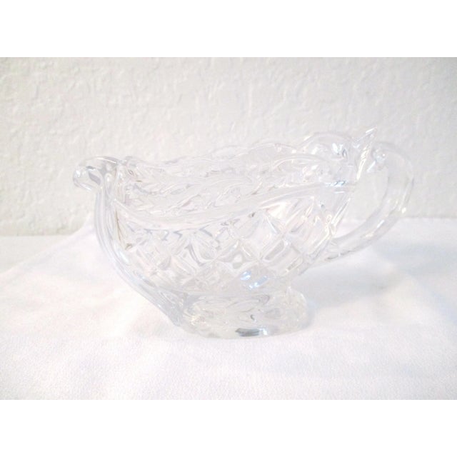 Lovely crystal gravy/sauce boat in a sleigh-motif. Beautiful for your holiday table. Excellent condition. See alternate...