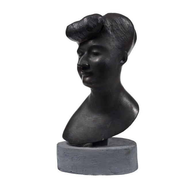 Head Of Woman is an original bronze sculpture realized by Emilio Greco. Signed by the artist. Excellent conditions. The...