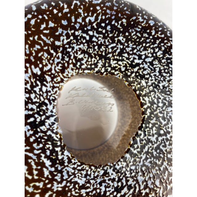 A lovely Kosta Boda glass vase or planter. The specked details makes this glass vase or planter very appealing accentuated...