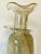 Stunning pair of candleholders from Maestri Vetrai. Hand-blown of Murano glass, the slender bodies have brilliant gold...