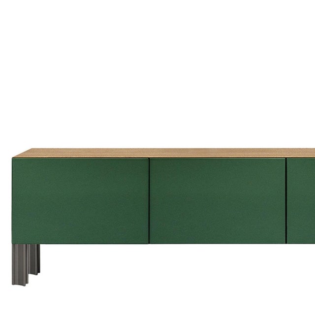 Defined by Robert Stadler's Flexor system, this living sideboard pairs green polished-lacquered wood containers with a...