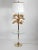 Spectacular brass palm leaf floor lamp/table. 20in Round glass table top stands 26in off floor. Weighted tulip brass base...