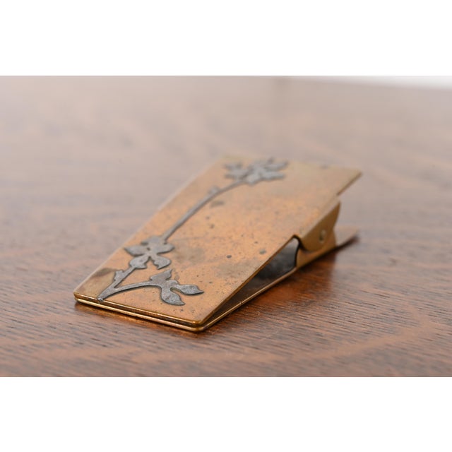 A gorgeous antique Arts & Crafts or Art Deco period sterling silver on bronze paper clip By Heintz Art Metal Shop USA,...
