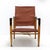 wonderful safari chair designed by Kaare Klint for Rud. Rasmussen’s Snedkerier, with patinated ash frame, seat, back,...