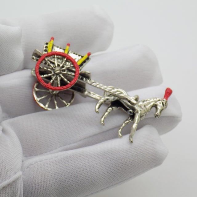 This vintage silver decorative object depicts a traditional Sicilian carriage or Carretto Siciliano with hitched horse,...