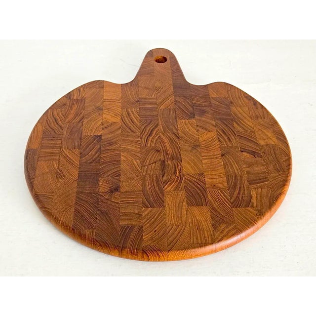 Offered is a Danish teak wood staved end grain charcuterie/carving board. Made in Denmark in the 1960s most likely by...