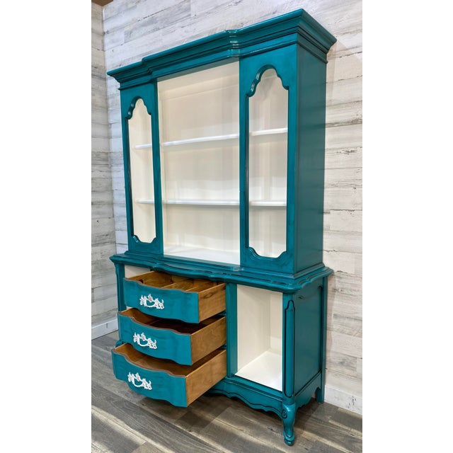 Refinished Bassett brand hutch. French provincial style. Turquoise with cream white interior. one solid piece. All doors...