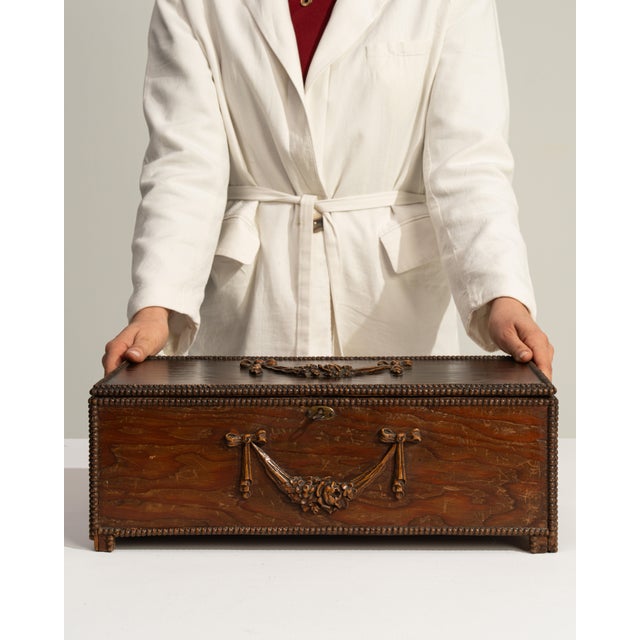 This 1900 - 1909 Victorian box from United Kingdom is finished in chocolate, worked in wood. Its design carries the...