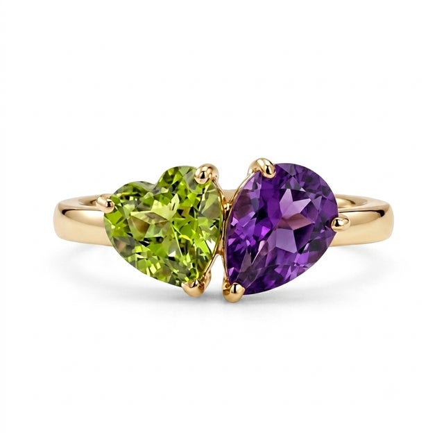 Celebrate harmony and elegance with this beautifully crafted two-stone gemstone ring, featuring a vibrant 5mm heart-cut...