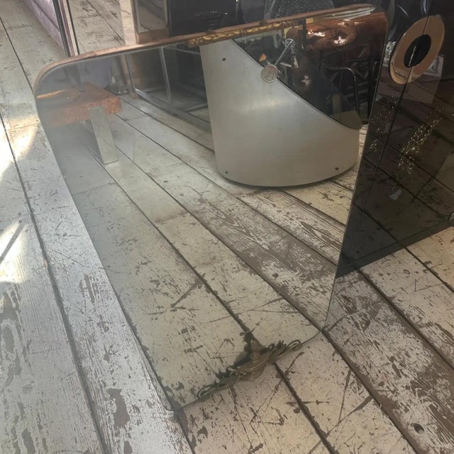 An exceptional and elegant Italian Mid-Century Modern wall mirror, attributed to the highly influential style of Gio Ponti...