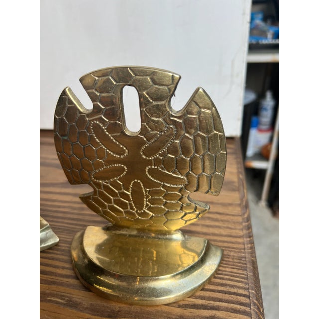 Vintage brass Sand Dollar seashell bookends. Made in the 1960s