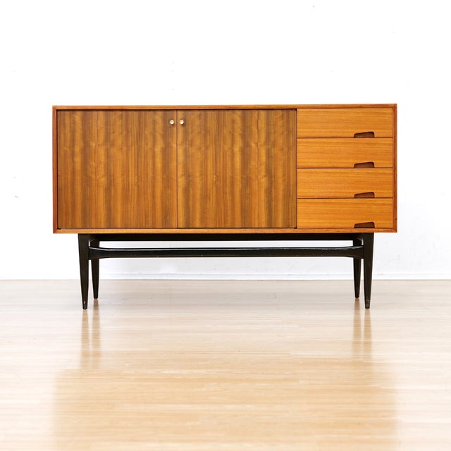 This stunning mid-century credenza was produced by Wrighton Furniture during the 1960s. With a minimalist design and...