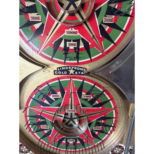 Metal Marble game Board. Lindstroms Gold Star game. Shoot marble and land in specific locations for points to win....
