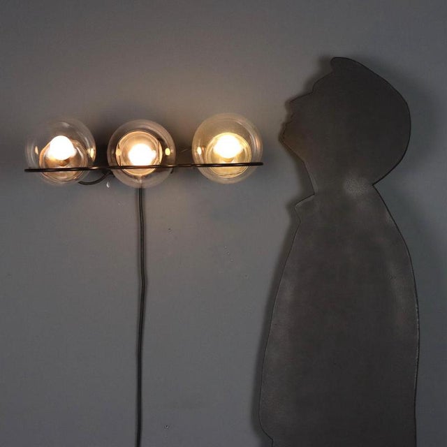 Vintage wall lamp based on the '237/3' model by Gino Sarfatti for Arteluce, from the 1960s. Black lacquered metal frame...