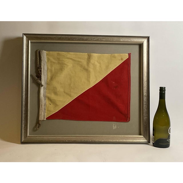 Maritime signal flag representing the letter “O”, oscar. The flag has red and yellow stitched panels with canvas hoist....