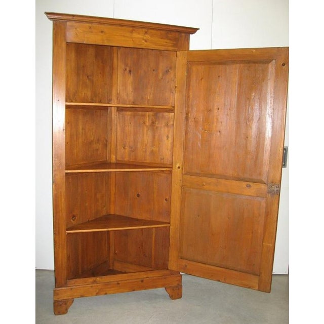 CODE 3821-03 Antique corner cabinet, early 1900s, made of fir. Antique solid fir corner piece. 20th century Northern Italy...