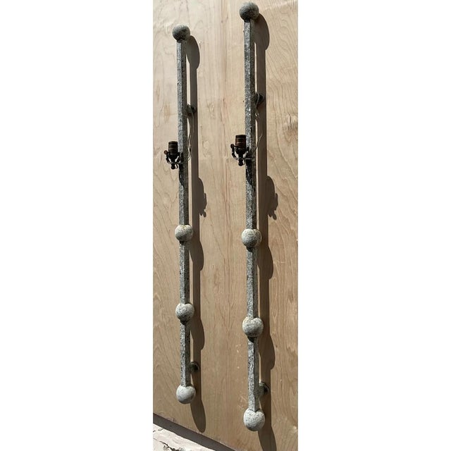 Standing an impressive 52 inches tall, this striking pair of vintage wall sconces combines a slender, linear profile with...