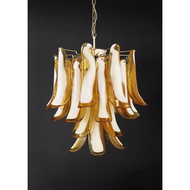 Italian vintage Murano chandelier made by 26 glass petals (amber and white “lattimo”) in a chrome frame. Period: late XX...