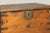 Brown Antique Wood Trunk with Ornamental Metalwork and Brass Hardware For Sale - Image 8 of 12