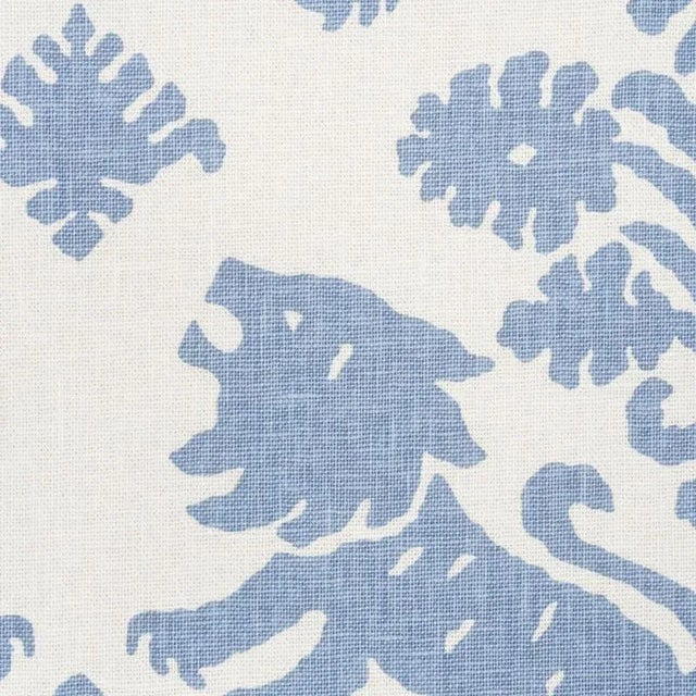 This artisanal print features mirrored silhouettes of rampant lions and stylized flowers on a textural union cloth ground....