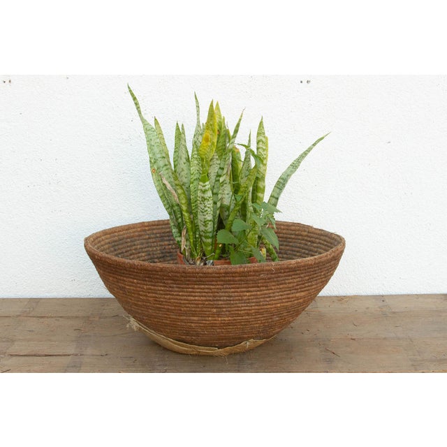 At an impressive 25 inches wide, this deep nomadic harvest bowl is a remarkable piece of utilitarian history. In...