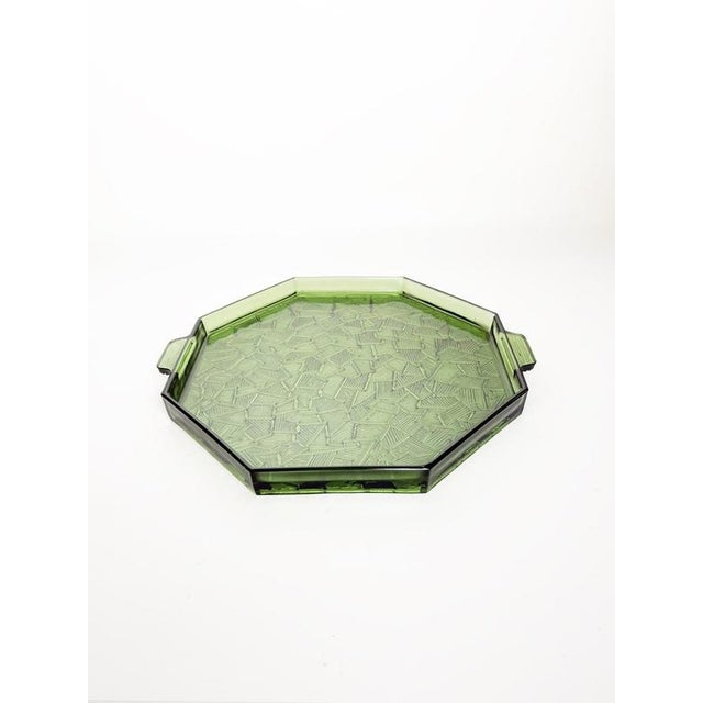 Elegant French glass serving tray dating from the 1940s. Made from green pressed glass, the piece features a geometric...