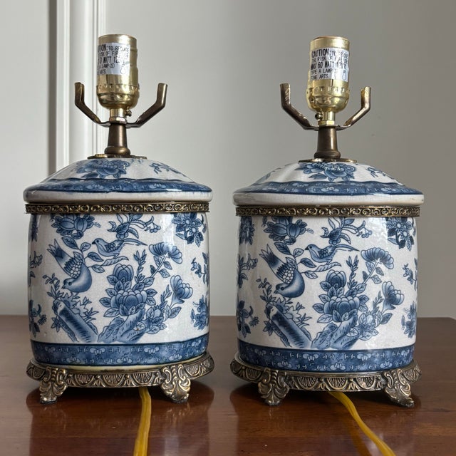 Absolutely stunning pair of vintage blue and white porcelain chinoiserie ginger jar style table lamps. Hand-painted floral...
