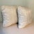 Made in the USA, a pair of decorative accent pillows with corded trim in ivory white . Pillows are still a plush 16” square.