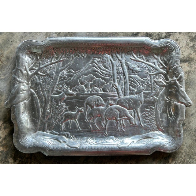 Impressive large vintage cast aluminum serving tray featuring an intricately rendered woodland scene with a herd of deer...