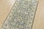 This traditional Oushak rug is hand-knotted with an all-wool pile on a cotton foundation. This rug is new and in excellent...