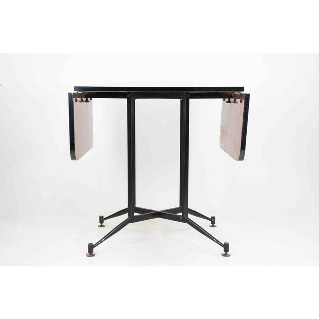 Vintage Coffee Table realized by an italian manufacture in 1950s. Wood, laminate, painted iron and brass. Very good...