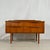 Vintage austinsuite sideboard with a 2x2 drawer layout, crafted from warm teak in a clean mid-century design. The piece is...
