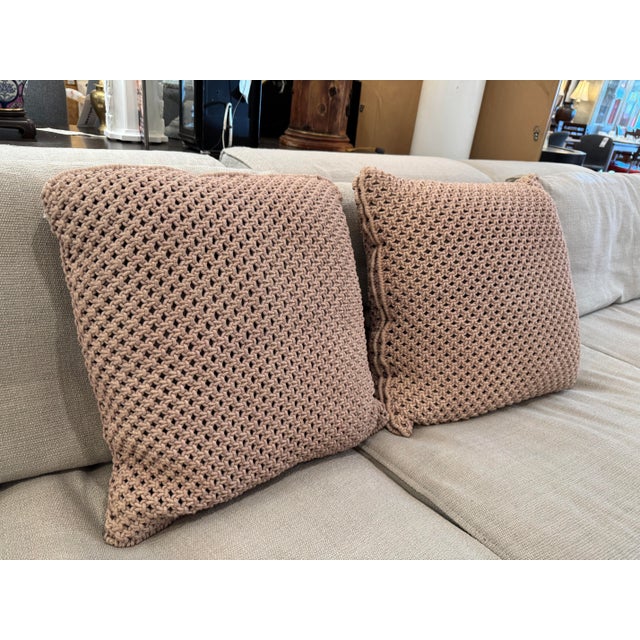 Design Plus Gallery presents a Pair of Chunky Throw Pillows in Mocha of Feather & Down. The pillows have a plush body...