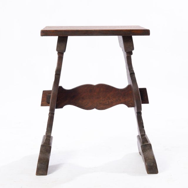 Carved oak stand. Could be used as a small bench or footrest if interested. Detailed carvings along the legs. Can add a...