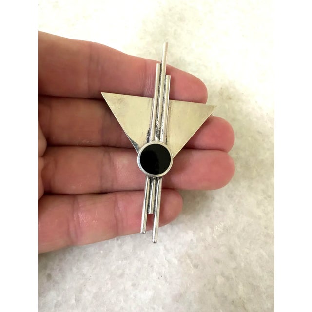 Wonderful art deco sterling silver and onyx brooch. Marked "Mexico S25"
