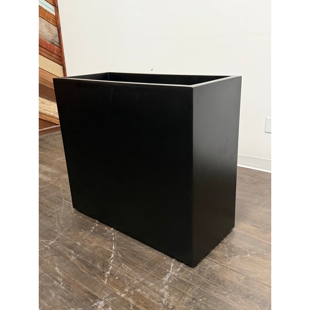 Design Plus Gallery presents the Tolga Fiberglass Planter from Jay Scotts. The planters architectural profile is molded...