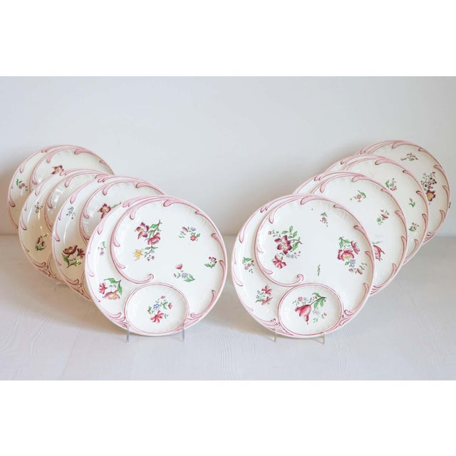 Ten French Sarreguemines Majolica asparagus plates from the 19th century with floral décor, priced and sold individually....