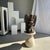 Traditional Indonesian sculpture of a winged deity in volcanic limestone. Height: 60cm; Base dimensions: 27cm x 29cm;...